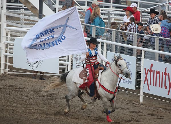 Cowgirl with Park City Painting flag