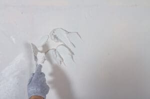 Applying plaster to a wall